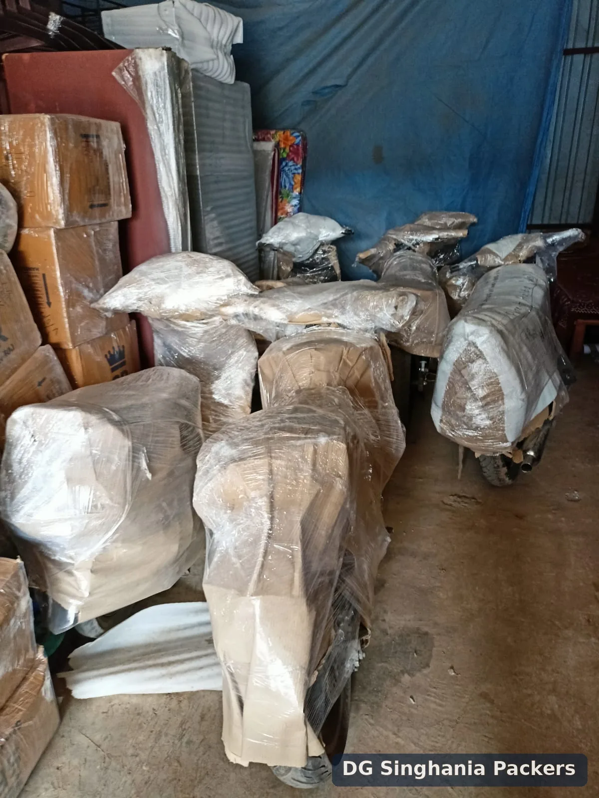 Motorcycles wrapped with protective material for transport from Pune