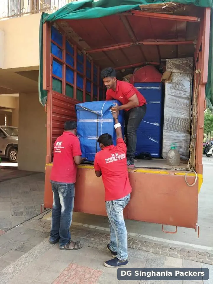 Moving crew loading packed household goods into a truck in Pune