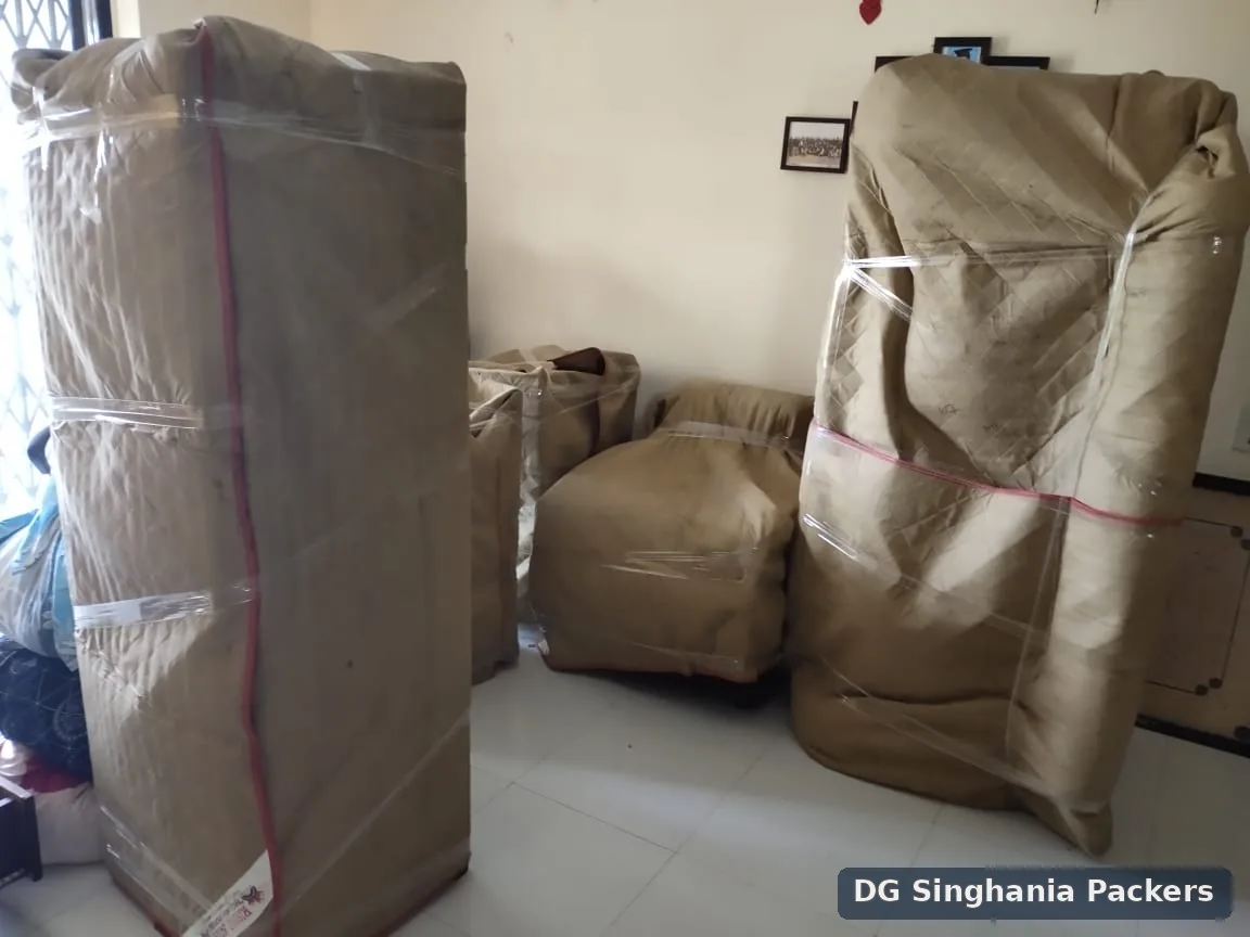 Large household furniture wrapped for a local move in Pune