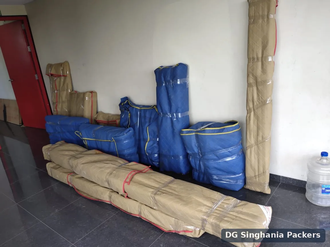 Furniture packed in protective moving covers for local shifting in Pune
